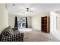 Living room featuring a plaid couch and built-in shelving at 3621 Ronda Dr, Deltona, FL 32738