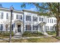 Row of townhouses on tree-lined street at 4459 Twinview Ln, Orlando, FL 32814