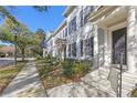 Townhouse with black door and white columns at 4459 Twinview Ln, Orlando, FL 32814