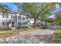 Residential street with parked cars and townhouses at 4459 Twinview Ln, Orlando, FL 32814