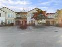 Front view of charming townhouses with well-manicured landscaping at 4775 Terrasonesta Dr, Davenport, FL 33837