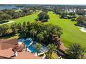 Luxury home with pool and spa overlooking a lush golf course at 5271 Isleworth Country Club Drive, Windermere, FL 34786