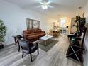 Bright living room with hardwood floors and comfortable seating at 259 Grand Rapids Dr, Poinciana, FL 34759