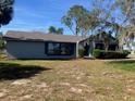 Ranch style home with a large front yard at 5241 Magnolia Ter, Fruitland Park, FL 34731