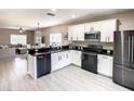 Modern kitchen with stainless steel appliances and granite countertops at 1030 Bending Oak Trl, Winter Garden, FL 34787