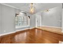Spacious living room with hardwood floors and a large window at 333 N Spaulding Cv, Lake Mary, FL 32746