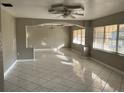 Spacious living area with tile floors and large windows at 63 W Magnolia St, Apopka, FL 32703