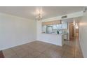 Kitchen features a breakfast bar, white cabinets, and appliances at 8709 Rockingham Ter # A, Kissimmee, FL 34747
