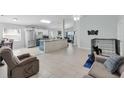 Open floor plan living room and kitchen area at 2080 Cobblefield Cir, Apopka, FL 32703