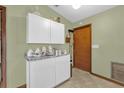 White kitchen cabinets and granite countertops at 3007 Fayson Cir, Deltona, FL 32738