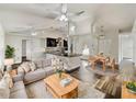 Open living space with modern kitchen and dining area at 5933 Bible Camp Rd, Groveland, FL 34736