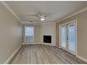 Cozy living room with fireplace and access to the backyard at 1440 Dann St, Orlando, FL 32804