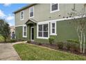 Front entrance of townhome with landscaping and walkway at 1473 Broken Oak Dr # C, Winter Garden, FL 34787