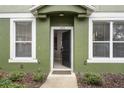 Open front door revealing interior of the townhome at 1473 Broken Oak Dr # C, Winter Garden, FL 34787