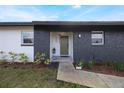 Inviting front entrance with olive green door and landscaping at 4856 Victory Dr, Orlando, FL 32808