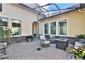 Outdoor seating area with fire pit and covered patio at 3875 Grassland Loop, Lake Mary, FL 32746