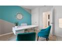 Home office with teal and gray accent walls at 4133 Giorgio Dr, Winter Haven, FL 33884