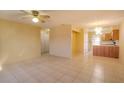 Bright living room with tile floors and access to kitchen at 79 Lake Villa Way, Kissimmee, FL 34743