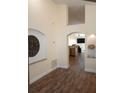 Open floor plan with hardwood floors and high ceilings at 7947 Golden Pond Cir, Kissimmee, FL 34747