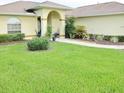 Landscaped front yard with walkway leading to covered entryway at 3281 Nw 47Th Ct, Ocala, FL 34482