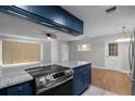 Updated kitchen with stainless steel appliances and granite countertops at 36 Marigold Ln, Debary, FL 32713
