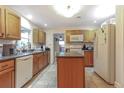 Spacious kitchen with an island, ample cabinetry, and modern appliances at 402 Satsuma Dr, Sanford, FL 32771