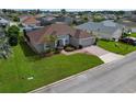One story house, brown roof, gray siding, and a nicely landscaped yard at 344 Barbera Dr, Davenport, FL 33897