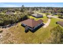 House with a backyard, shed, and a long driveway at 10181 Sw 46 Ct, Ocala, FL 34476