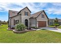 Two-story house, landscaped yard, and driveway; nice neighborhood at 6701 Sw 94Th Cir, Ocala, FL 34481