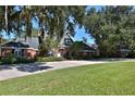 Brick home with large lawn and driveway at 1321 Sw 42Nd St, Ocala, FL 34471