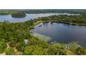Breathtaking aerial view of lakefront property with lush surroundings at 22649 Ne 105Th Avenue Rd, Fort Mc Coy, FL 32134