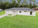 Newly built home with a white exterior and gray roof at 00 Sw 22Nd Pl, Ocala, FL 34481