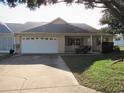 Single story home with a two car garage and mature landscaping at 9002 Sw 96Th Ln # C, Ocala, FL 34481