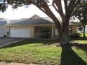 Single story home with a two car garage and mature landscaping at 9002 Sw 96Th Ln # C, Ocala, FL 34481