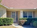 Single-story house with a covered entryway at 10787 Sw 53Rd Cir, Ocala, FL 34476