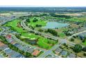 Aerial view of home in golf course community at 3554 Nw 55Th Cir, Ocala, FL 34482