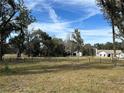 Open pasture with wooden fencing, ideal for horses at 14731 W Highway 328, Ocala, FL 34482