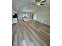 Open concept living room and kitchen with vinyl flooring at 12 Pecan Run Radl, Ocala, FL 34472