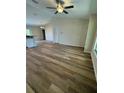 Open concept living room and kitchen with vinyl flooring at 12 Pecan Run Radl, Ocala, FL 34472