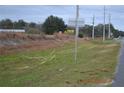 Roadside view of vacant land with Dollar General sign at 16684 And 16690 S Us Highway 301, Summerfield, FL 34491
