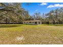 Ranch home, spacious backyard, and large oak trees at 11782 Sw 140Th St, Dunnellon, FL 34432