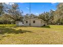 Rear view of the house with shed and large yard at 11782 Sw 140Th St, Dunnellon, FL 34432