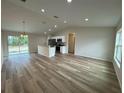 Open kitchen with stainless steel appliances and an island at 233 Locust Ln, Ocala, FL 34472