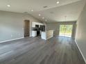Open kitchen with stainless steel appliances and an island at 235 Locust Ln, Ocala, FL 34472