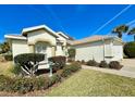 Home exterior with landscaped yard and walkway at 15338 Sw 14Th Avenue Rd, Ocala, FL 34473