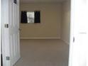 Empty bedroom with carpeted floor and window at 14885 Se 106Th Ave, Summerfield, FL 34491