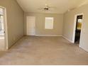 Spacious living room with carpeted floors and ceiling fan at 7946 Juniper Rd, Ocala, FL 34480