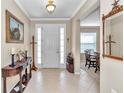 Inviting entryway showcasing hardwood floors and views of the dining area at 9375 Sw 71St Loop, Ocala, FL 34481