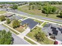 Aerial view of a house with a gray roof and solar panels at 4725 Sw 62Nd St, Ocala, FL 34474