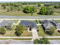 Aerial view of a house with a gray roof and solar panels at 4725 Sw 62Nd St, Ocala, FL 34474